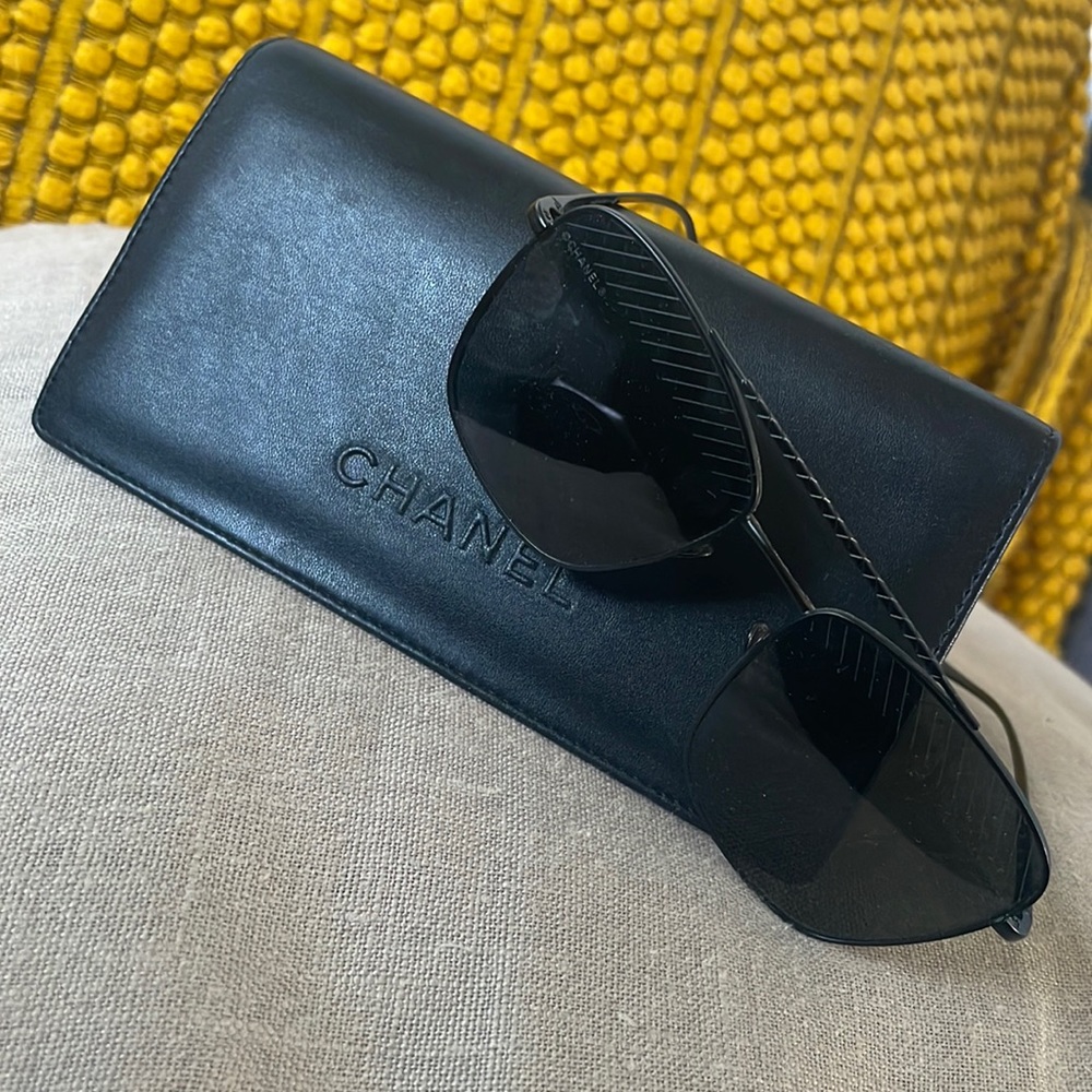 Black Pilot Chanel sunglasses for women.